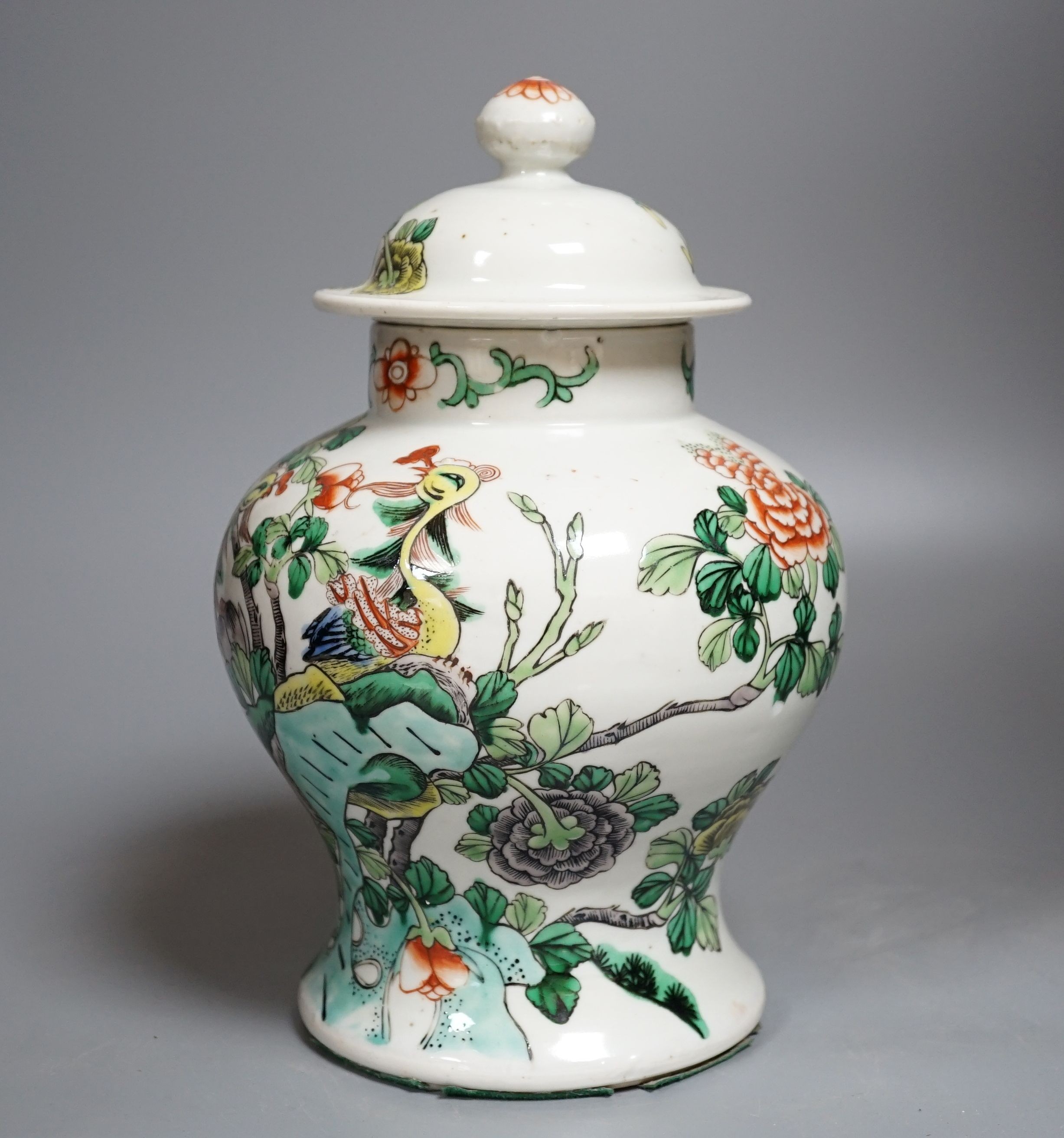 A Chinese Famille-Verte jar and cover decorated with Phoenix and flowers, 26cm